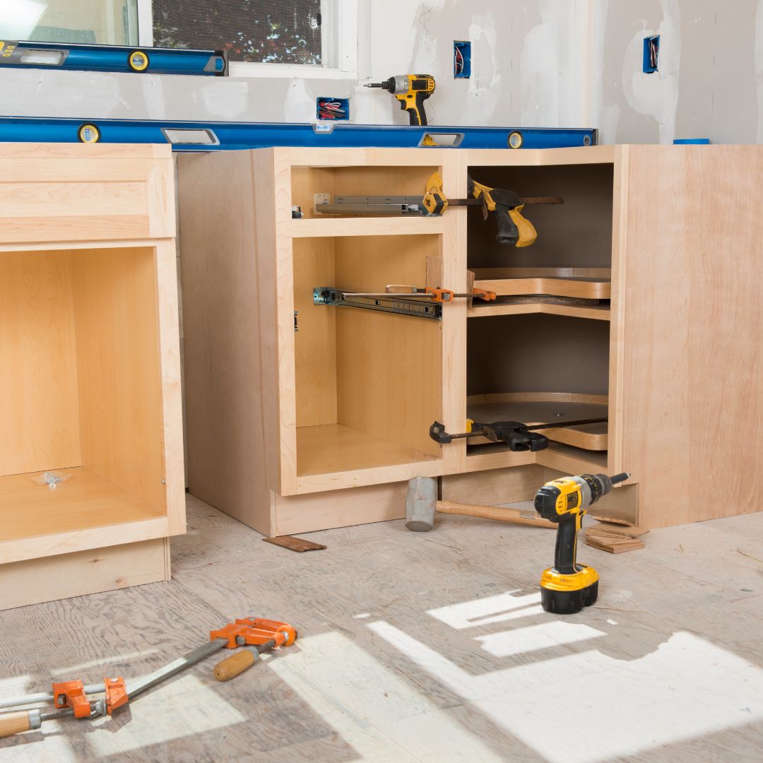 kitchen cabinets being installed